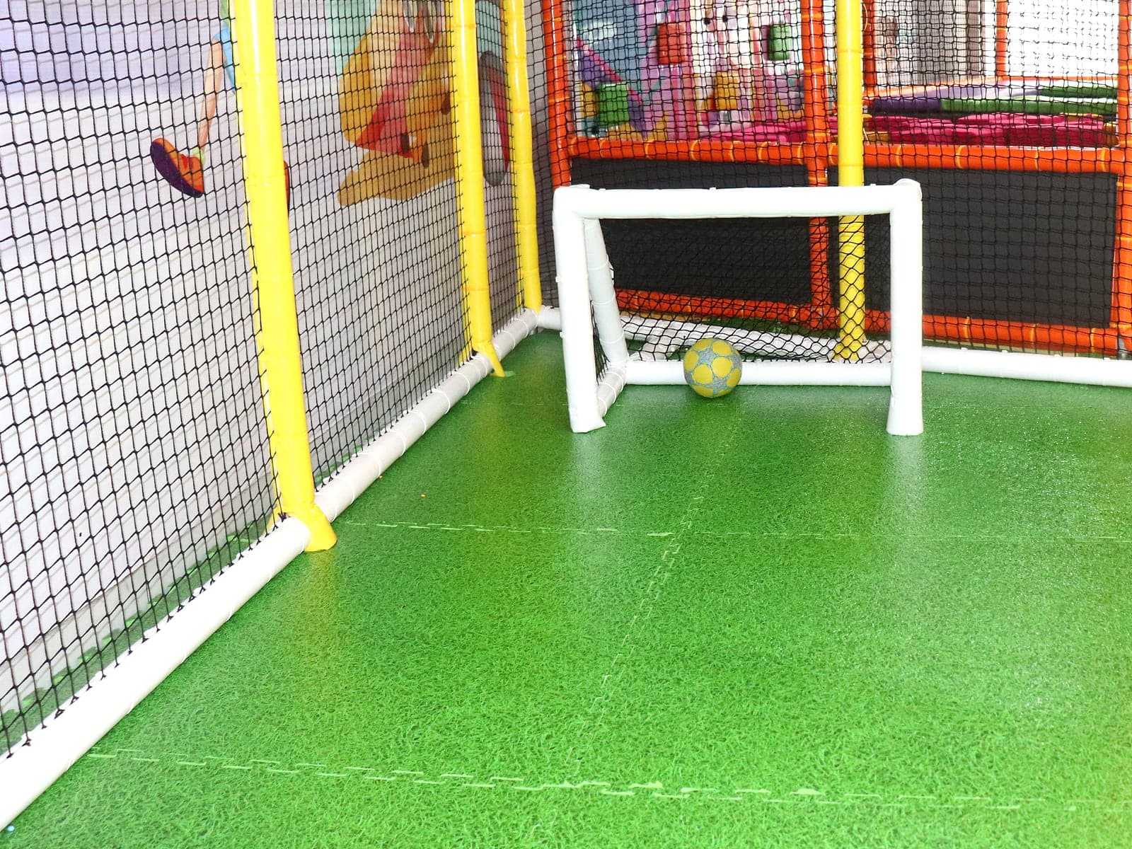 Indoor mini football turf used for school group games at Little Peppe